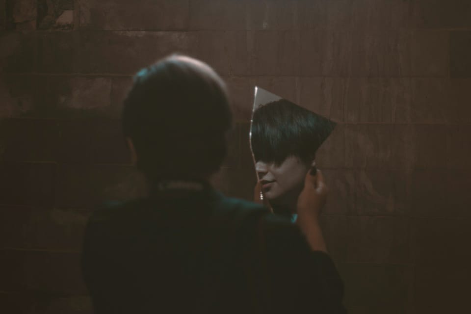 woman holding mirror